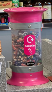 A C-Thru 5L Battery Recycling Bin in a shop
