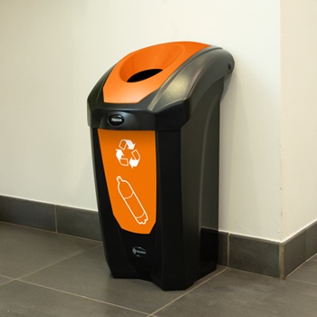 nexus 30 bottle recycling bin against a white wall at a corner in a corridor