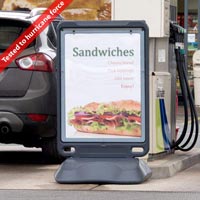 Advocate™ Floor Standing Poster Display Sign sited by the petrol pumps